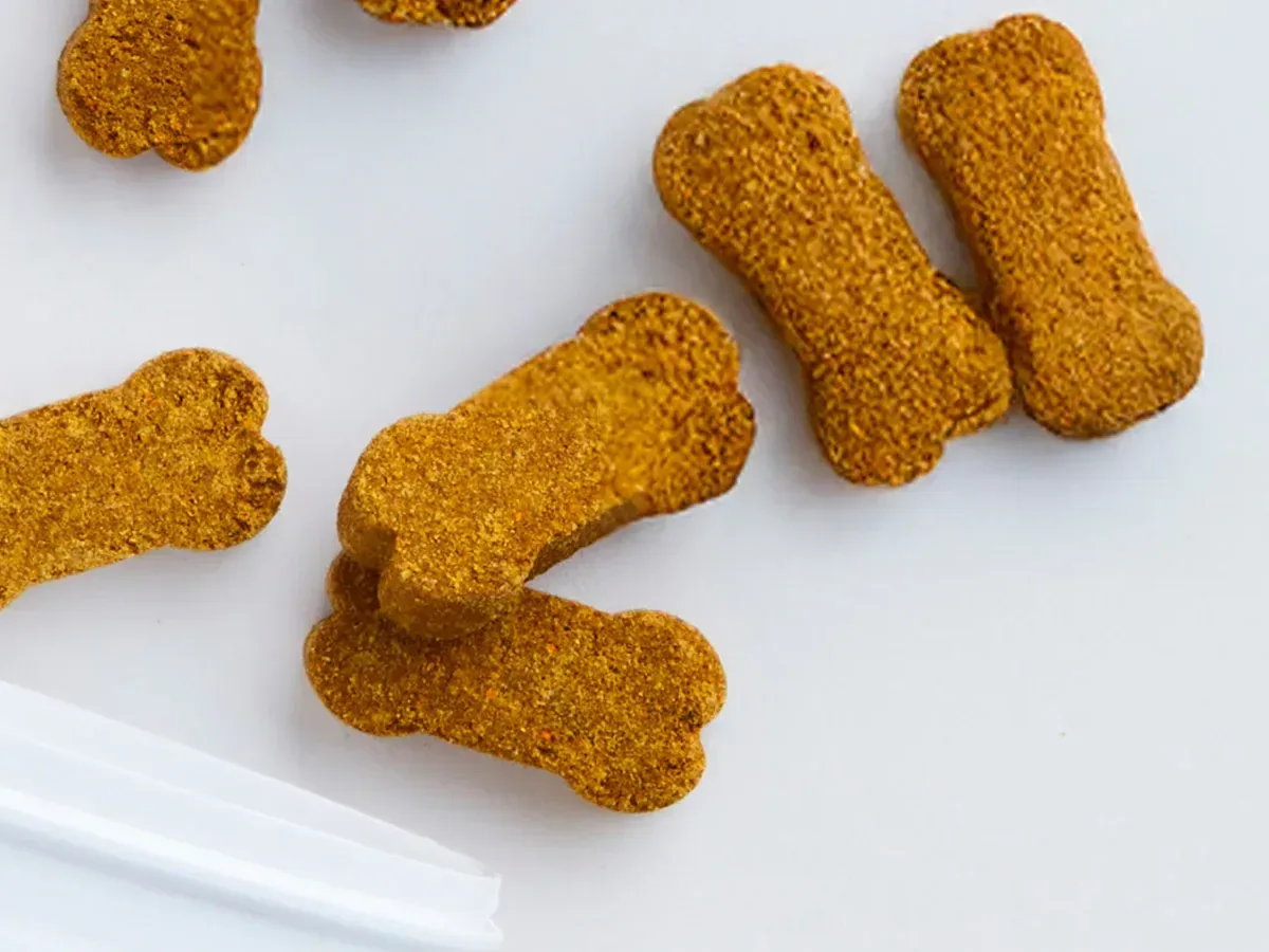 Soft-baked Calm Chews scattered on a white surface.